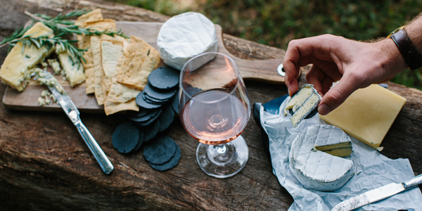 The Perfect Pair: Exploring the History and Harmony of Wine and Cheese